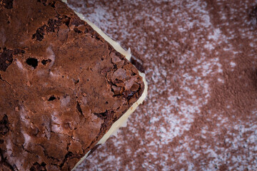 Chocolate brownie with milk powder delicious filling. Closeup photography.