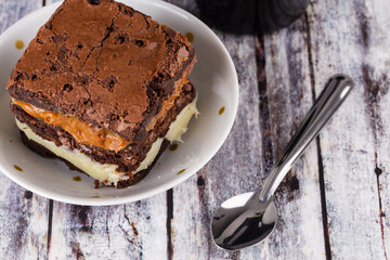 Chocolate brownie with milk powder delicious filling. Closeup photography.