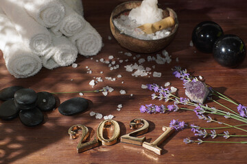 Lavender sprigs for aromatherapy and spa set next to 2021 numbers in golden metal