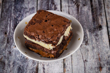 Chocolate brownie with milk powder delicious filling. Closeup photography.