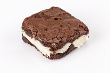 Fototapeta na wymiar Chocolate brownie with milk powder delicious filling. Closeup photography.
