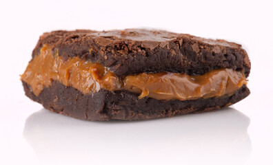 Chocolate brownie with delicious dulce de letche filling. Closeup photography.