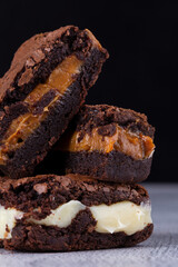 Chocolate brownie with delicious filling. Closeup photography.