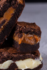 Chocolate brownie with delicious filling. Closeup photography.
