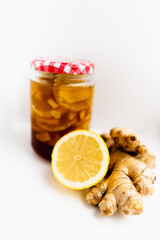Lemon, ginger home made remedy for cold. Presented on white background.