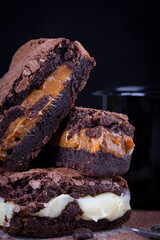 Chocolate brownie with delicious filling. Closeup photography.