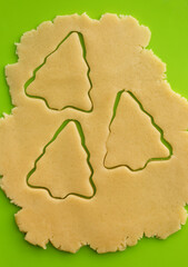 Raw dough for holiday cookies on the table. 