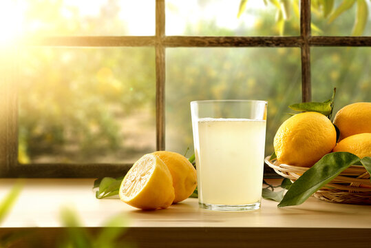 Homemade lemonade on kitchen with window and orchard outside