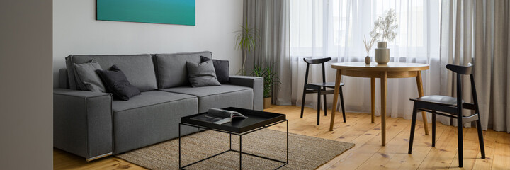 Living room with dining table, panorama