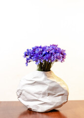 Beautiful bouquet of cornflowers on a white background