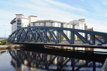 The Victoria swing bridge at Leith Docks, Edinburgh, Scotland, UK.  Constructed fro 1871 to 1874, now disused.  The new flats behind the bridge are part of the redevelopment of Leith.