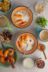 Healthy breakfast oatmeal and fruits, top view