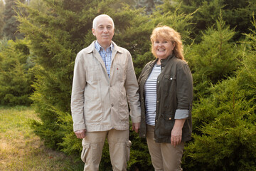 Senior elder caucasian couple together in park in spring or summer, autumn.