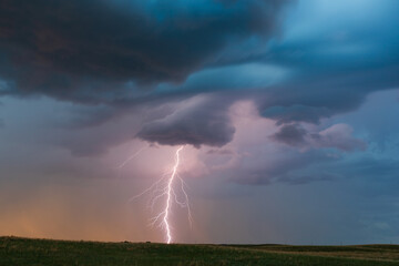 Obraz na płótnie Canvas Lightning storm and clouds at sunset