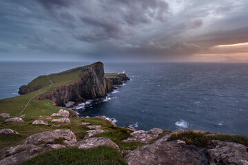 Dark and moody storm clouds over Neist Point lighthouse on the Isle of Skye. 