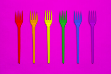 Plastic forks in the colors of the rainbow flag. LGBT Concept