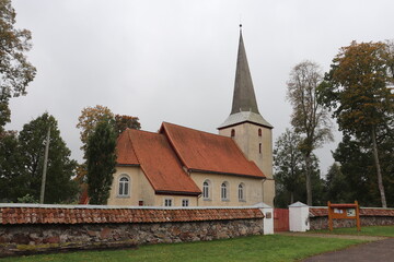 Fototapeta na wymiar An old Lutheran church in the small Latvian village of Apriki in autumn 2020