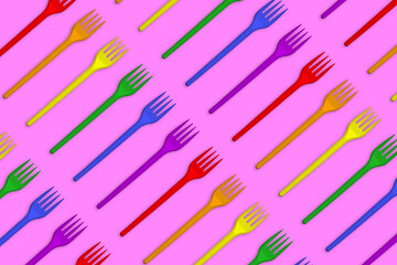 Multicolored plastic forks on a pink background. Creative minimal style