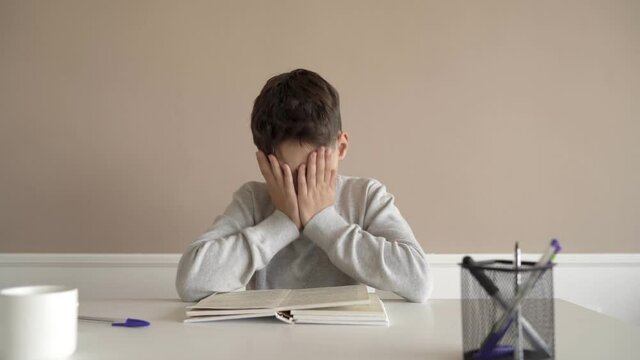School boy having trouble with his homework