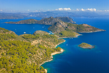Obraz premium view to curved green coastline with beautiful sky with clouds on horizon