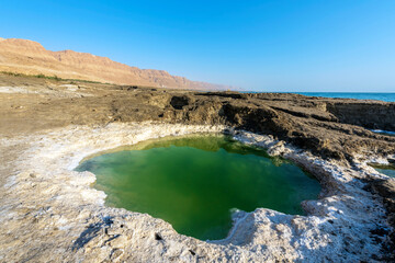 A small salt lake on the shores of the Dead Sea, the lowest point on earth on land, near Ein Gedi. Israel.
