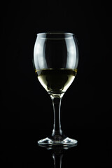wine bottle and glass, black background
