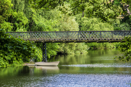 View of Orsted park (Orstedsparken, 1879) - a public park in central Copenhagen. Orsted Park is one in a series of parks which laid out on grounds of old fortification ring. Copenhagen, Denmark.