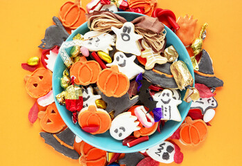 candy bowl of chocolates and sweets, Halloween Jack o Lantern cookies - Trick or Treat Halloween card background