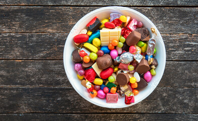 candy bowl of chocolates and sweets, Halloween Jack o Lantern cookies - Trick or Treat Halloween card background