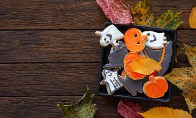 Halloween Jack o Lantern cookies, pumpkin, ghost, black cat, witch hat. Trick or Treat background	
