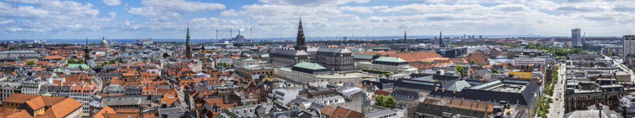 Naklejka na ściany i meble Panoramic view of Copenhagen city in sunny day from the City hall tower. Copenhagen, Denmark.