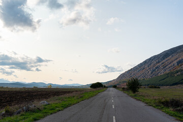 Country road through rural hillside autumn typical scene village asphalt farming ground trasnport