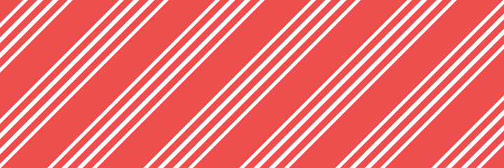 Vector Christmas background with diagonal stripes pattern, candy cane. Long horizontal banner.