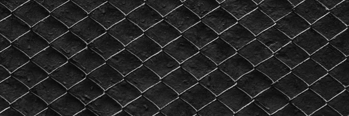 Fototapeta premium Metal mesh texture. Pattern of metal grid on a dark gray background. Perfect for design.