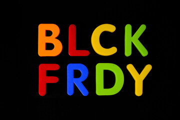 Black friday. Multi colored letters against black background