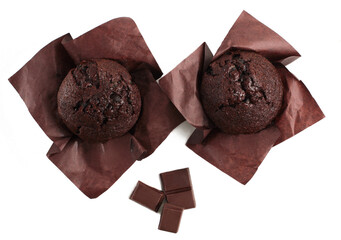 Chocolate muffins and chocolate bars isolated on a white background. Top view