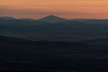 Landscape sunset colors over mountains and hills orange red yellow blue shades natural beauty bulgaria rural