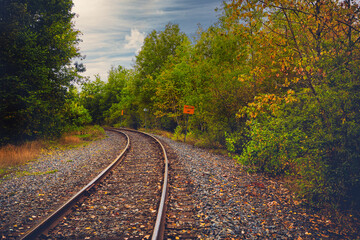 Obraz premium Railroad tracks during fall season in old Noranda, Quebec, Canada.