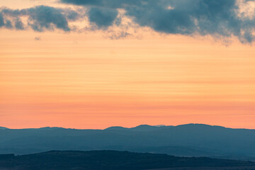 Landscape sunset colors over mountains and hills orange red yellow blue shades natural beauty bulgaria rural