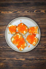 delicacy product red salmon caviar flat lay top view with copy space text on wooden table, healthy organic eco food concept