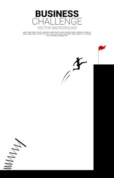 Silhouette of businessman jump to red flag on cliff with springboard. Concept of boost and growth in business.