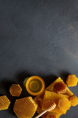 Healthy Thick honey dipping from the wooden honey spoon, bee products by organic natural...