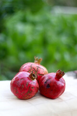 Fresh pomegranates, picked from the garden. Selective focus.