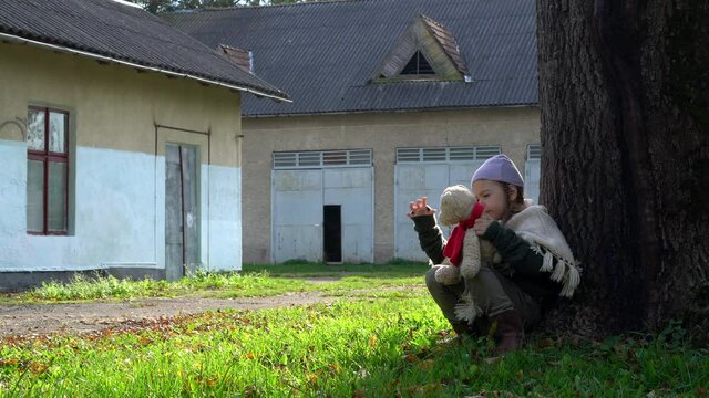 Little girl aged five scared of adult. Child abuse concept.