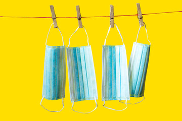 medical masks isolated on yellow background. protection against coronavirus.