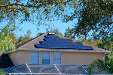 Solar panel on a house roof; Green energy from sun	