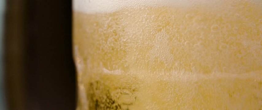 pouring beer into a glass
