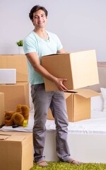 Young man moving to new apartment