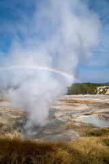Beautiful rainbow over Norris Geyser Basin in Yellowstone National Park