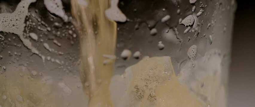 pouring beer into a glass